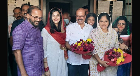 Advocate C Shukkur and Dr Sheena Shukkur with their daughters, friends, and relatives at Hosdurg sub-registrar office in Kasaragod on Wednesday. (Photo | Express)