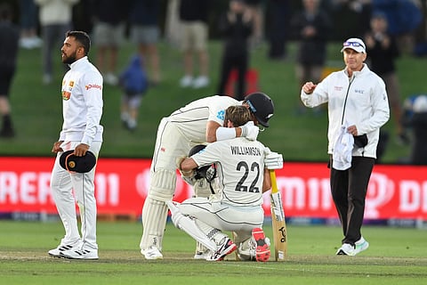 New Zealand's Neil Wagner (2L) hugs Kane Williamson after winning the first Test cricket match against Sri Lanka at Hagley Oval in Christchurch on March 13, 2023. (Photo | AFP)