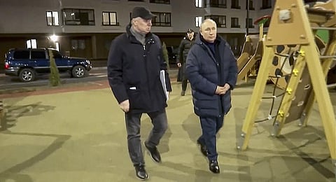 In this photo taken from video released by Russian TV Pool, Russian President Vladimir Putin (R) visits Mariupol in Russian-controlled Donetsk region in Ukraine. (Photo | AP)