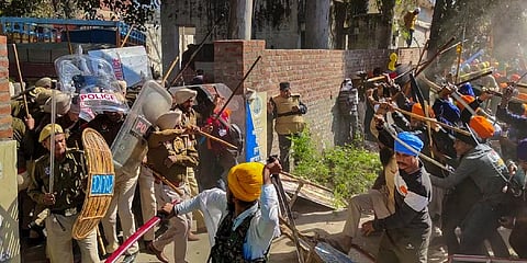 Followers of Amritpal Singh clash with the police while breaking through barricades at the police in protest against filing of FIR against him and his associates. (File Photo | PTI)