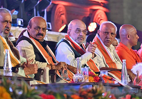 Karnataka CM Basavaraj Bommai along with Union Minister Amit Shah and former CM B S Yediyurappa. (Photo | Nagaraja Gadekal, EPS)