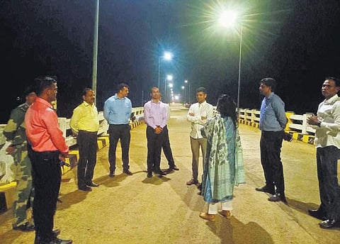 The officials visiting Gurupriya bridge on Tuesday night | Express