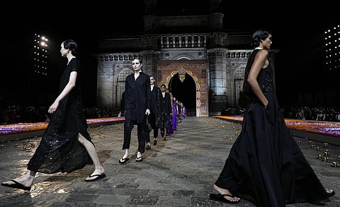 Models display creations for the Dior Pre-Fall 2023 collection at the Gateway of India landmark monument in Mumbai, India on Thursday, March 30, 2023. (Photo | AP)
