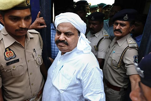 Gangster-turned-politician Atiq Ahmad being produced in a court in connection with the Umesh Pal murder case. (Photo | PTI)
