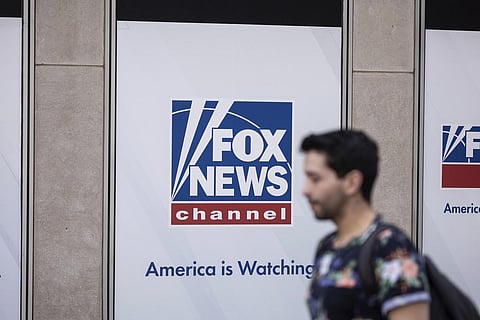 A person walks past the Fox News Headquarters in New York, April. 12, 2023. (Photo | AP)
