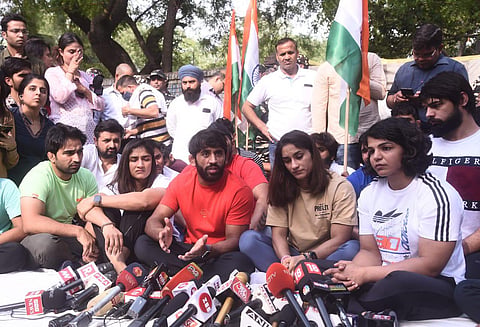 Wrestlers Bajrang Punia, Vinesh Phogat and Sakshi Malik return to Jantar Mantar to protest against the WFI President, in New Delhi on Sunday. (Photo | Parveen Negi, EPS)