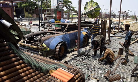 A vintage gramophone, telephone, hand pump, car and talisman are being made by the sculptors. (Photo | S Senbagapandiyan, EPS)