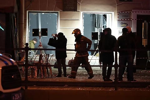 Russian investigators work at the side of an explosion at a cafe in St. Petersburg, Russia, Sunday, April 2, 2023. (Photo | AP)