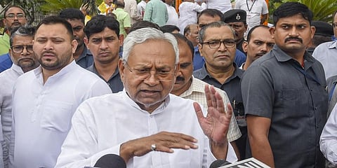 Bihar Chief Minister Nitish Kumar (C) with Deputy Chief Minister Tejashwi Yadav speaks to the media in Patna, April 29, 2023. (Photo | PTI)