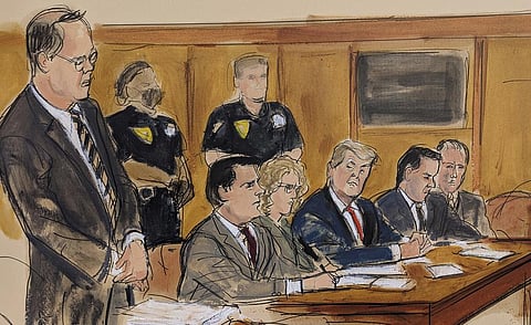 This artist sketch depicts former US President Donald Trump, seated center, during his arraignment in court, April 4, 2023, in New York. (Photo | AP)