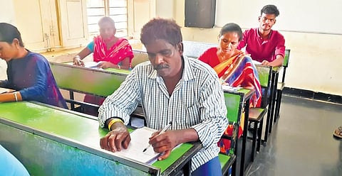 Y Yellamma (55) of Saluru, and Y Narasimhulu (55) and Y Satyavathi (50) of P Konavalasa appear for the SSC exams at Badragiri PTG Centre | Express