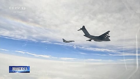 In this image taken from video footage run Saturday, April 8, 2023 by China's CCTV, a Chinese fighter jet performs an mid-air refueling maneuver at an unspecified location. (Photo | AP)