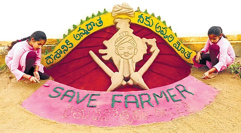 Budding sand artists Sohita and Dhanyata with their sand sculptures in Rangampet of East Godavari district I Express