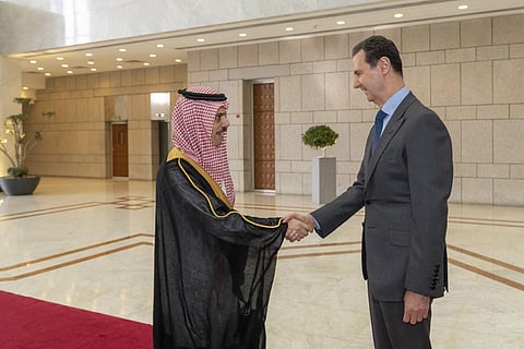 Syrian President Bashar Assad, right, welcomes Saudi Minster of Foreign Affairs Faisal bin Farhan, left, before their meeting in Damascus, Syria, on April 18, 2023. (Photo | AP)