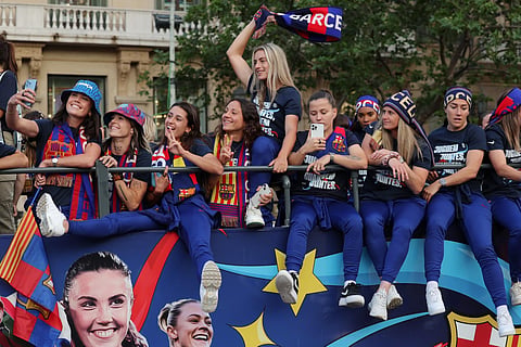 FC Barcelona women football team parade aboard a open-top bus. ( Photo | AFP )