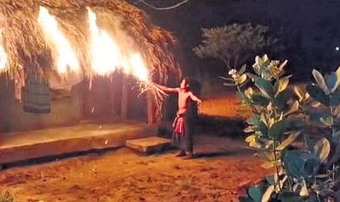 The video grab of the man burning down his own house | Express