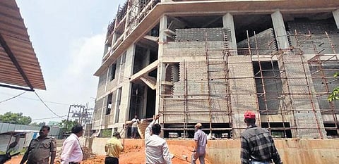 BDA officials conduct an inspection at the site of one hotel I Express