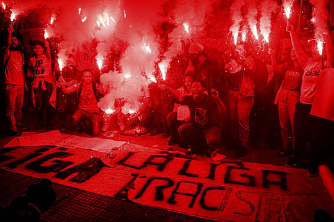 People protest against racism suffered by Brazilian soccer star Vinicius Junior who plays for Spain's Real Madrid, outside the Spanish Consulate in Sao Paulo, Brazil. (Photo | AP)