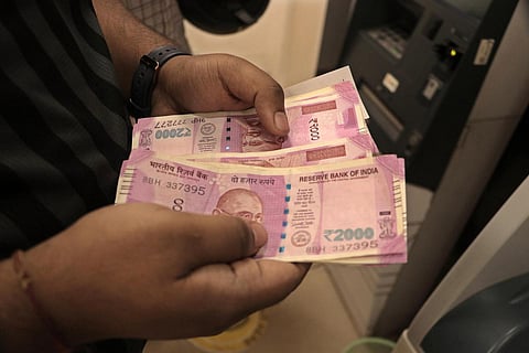 A man exchanging 2000 rupee notes in a bank, in Bhubaneswar. (Photo | Shamim Qureshy)