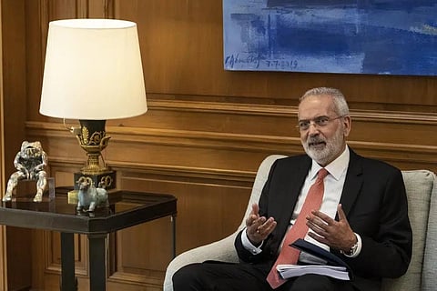 Greek Caretaker Prime Minister Ioannis Sarmas, speaks with outgoing Prime Minister Kyriakos Mitsotakis during a handover ceremony at Maximos mansion, in Athens, May 25, 2023. (Photo | AP)