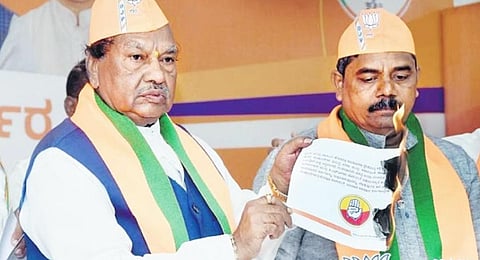 BJP MLA KS Eshwarappa burns a copy of the Congress manifesto in Kalaburagi on Thursday | Express
