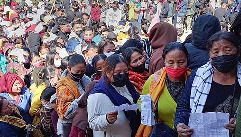 Did we vote for this? May 3, 2022: Voters holding ID cards stand in queues to cast their votes for the second phase of Manipur Assembly elections, in Senapati. (File Photo | PTI)