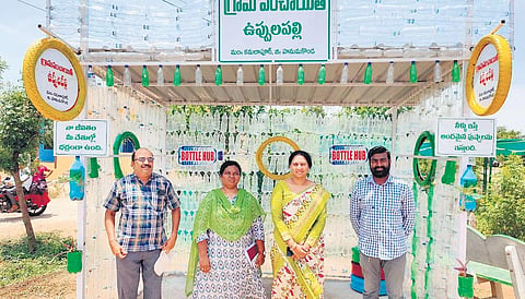 People wait at the bus stop at Uppalapally village in Hamankonda district