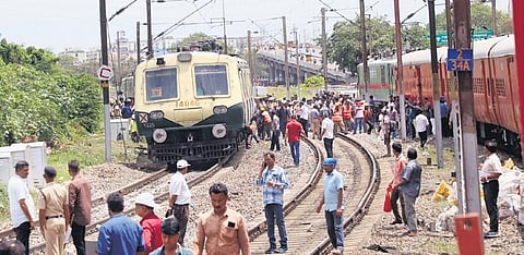 Railway workers trying to restore the train which got derailed near Basin Bridge railway station on Sunday | p ravikumar