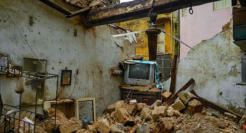 View of a damaged house in Gujarat's Porbandar due to heavy rainfall and strong winds ahead of Cyclone Biparjoy's landfall.(Photo | PTI)