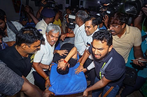 Senthil Balaji reacts in pain while being taken to a government hospital after his arrest in connection with a money laundering case, in Chennai, Tuesday night, June 13, 2023. (Photo | PTI)
