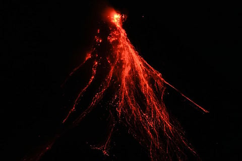 FILE - Lava flows down the slopes of Mayon volcano as seen from Legazpi, Albay province, northeastern Philippines, on June 15, 2023. (Photo | AP)