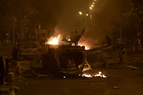 Youths clash with police forces on the third night of protests sparked by the fatal police shooting of a 17-year-old. (Photo | AP)