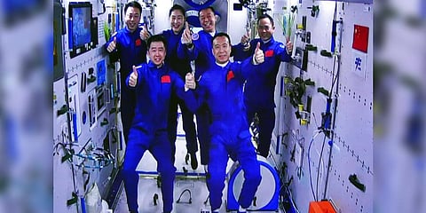 The Shenzhou-15 and Shenzhou-14 crew taking a group picture with their thumbs up after a historic gathering in space. (File photo)
