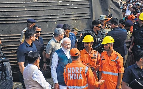 PM Narendra Modi at the accident spot with Railway Minister Ashwini. (Photo | Debadatta Mallick)