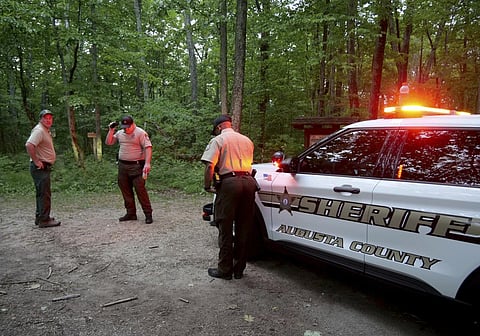 Authorities at the rescue operation along the Blue Ridge Parkway where a Cessna Citation crashed over mountainous terrain near Montebello, Virginia on June 4, 2023. (AP)