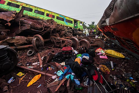Belongings of passengers trapped under the derailed compartments in Balasore, Odisha. (Photo | Debadatta Mallick, EPS)