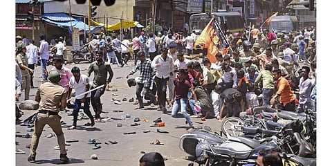 Security personnel disperse people protesting against the alleged use of Tipu Sultan s image in objectionable social media posts, in Kolhapur district. (Photo | PTI)