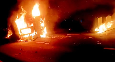 The passenger bus in flames after it overturned, on the Samruddhi Expressway. (Photo | PTI)