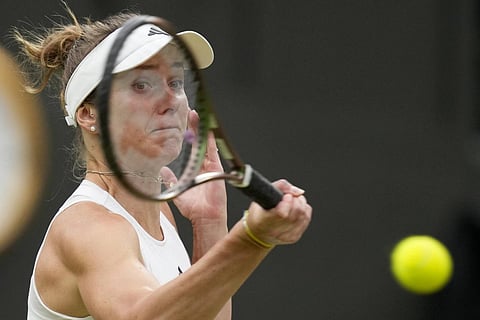 Ukraine's Elina Svitolina returns to Poland's Iga Swiatek in Wimbledon, July 11, 2023. (Photo | AP)