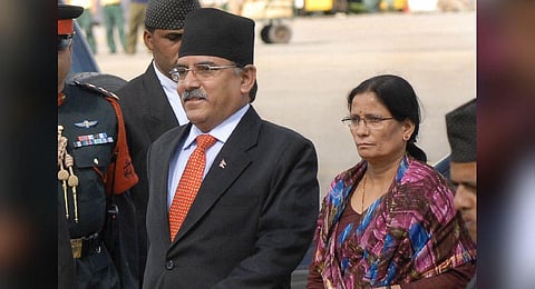 FILE - Nepalese Prime Minister Pushpa Kamal Dahal (L), accompanied by his wife Sita Dahal, arrives at Tribhuvan International Airport in Kathmandu on September 18, 2008. (Photo | AFP)
