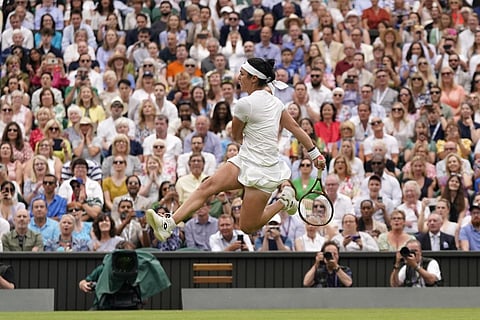 Tunisia's Ons Jabeur kicks the ball after failing to chase down a volley by Aryna Sabalenka of Belarus, Wimbledon, July 13, 2023. (Photo | AP)