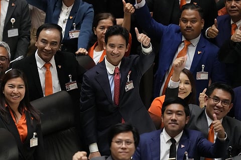 Pita Limjaroenrat (C), the leader of Move Forward Party and top winner in May's general election, gestures after the vote counting at the Parliament in Bangkok, July 13, 2023. (Photo | AP)