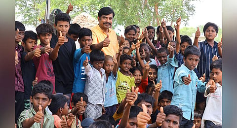 MG Rajamanickam, who turned his ancestral house into a coaching centre, posing with a group of students. (Photo | K K Sundar)
