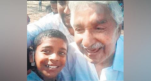 Rubin Jimmy with former chief minister Oommen Chandy. (Photo | Express)