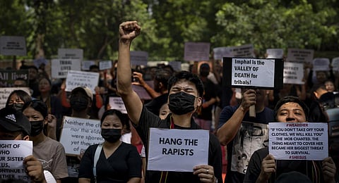 Kuki tribal protestors, in New Delhi, shout slogans during a demonstration against deadly ethnic clashes in Manipur, on Saturday, July 22, 2023. (Photo | AP)