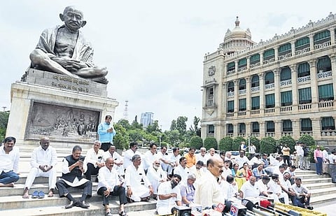 BJP leaders protest in front of the statue of Mahatma Gandhi outside Vidhana Soudha in Bengaluru | Nagaraja Gadekal