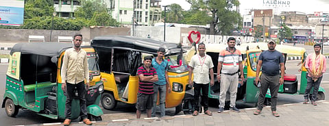 Dinabandhu Nayak and other members of Smart City Online Auto Association at Master Canteen Square in Bhubaneswar. (Photo | Shamim Qureshi, EPS)
