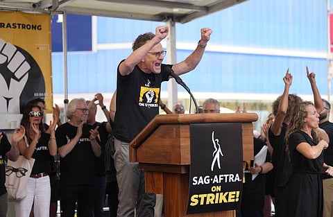 Actor Bryan Cranston speaks during the SAG-AFTRA 'Rock the City for a Fair Contract' rally in Times Square on Tuesday. (Photo | AP)