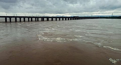 The swollen Godavari river flows in spate after heavy monsoon rainfall, in Bhadrachalam, Friday, July 21, 2023. (Photo | PTI)