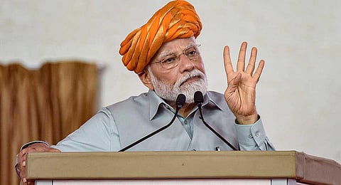 Prime Minister Narendra Modi addresses a public meeting after inaugurating Rajkot International Airport, in Rajkot, Thursday, July 27, 2023. (PTI)